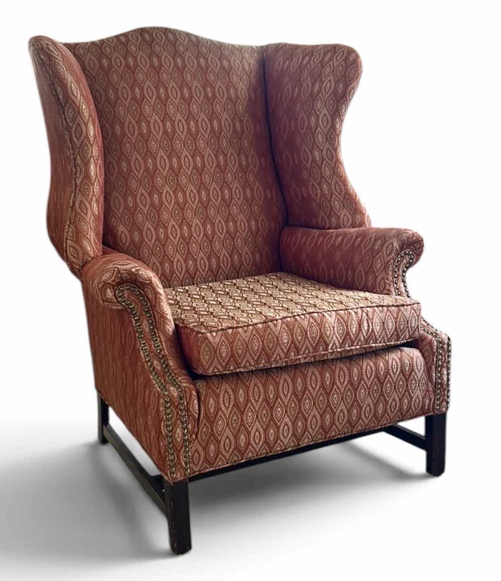 View 1 of TRADITIONAL STYLE WINGBACK CHAIR FEATURING A PATTERN, RED FABRIC AND DARK WOODEN LEGS 38“ X 35“ X H46“
