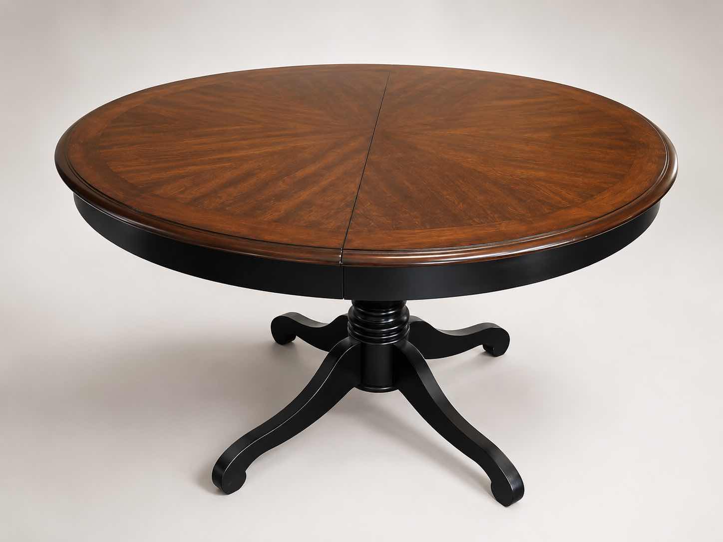 Photo 1 of MAHOGANY ROUND PEDESTAL DINING TABLE WITH DISTINCTIVE STARBURST VENEER PATTERN ON THE TOP AND A BLACK EBONIZED BASE. 4’ x 30” W/ 19” LEAF