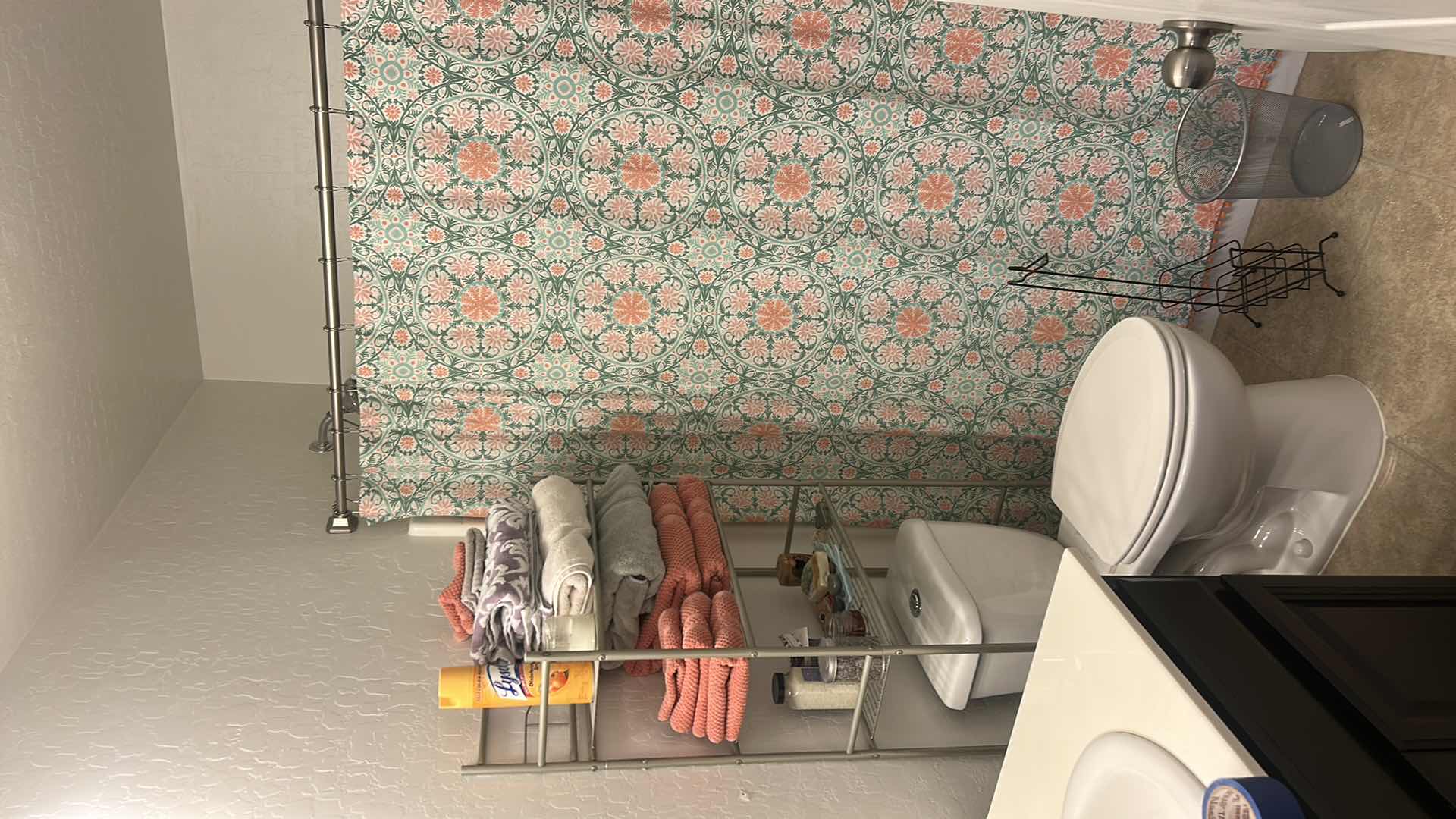 Photo 1 of BATHROOM ENSEMBLE – METAL RACK WITH CONTENTS, SHOWER, CURTAIN AND ROD, TRASHCAN, AND MORE