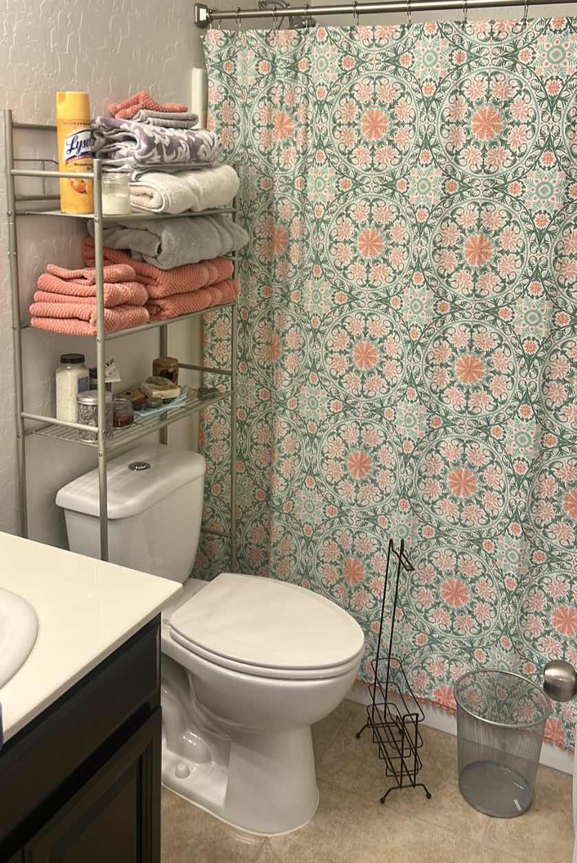 Photo 1 of BATHROOM ENSEMBLE – METAL RACK WITH CONTENTS, SHOWER, CURTAIN AND ROD, TRASHCAN, AND MORE