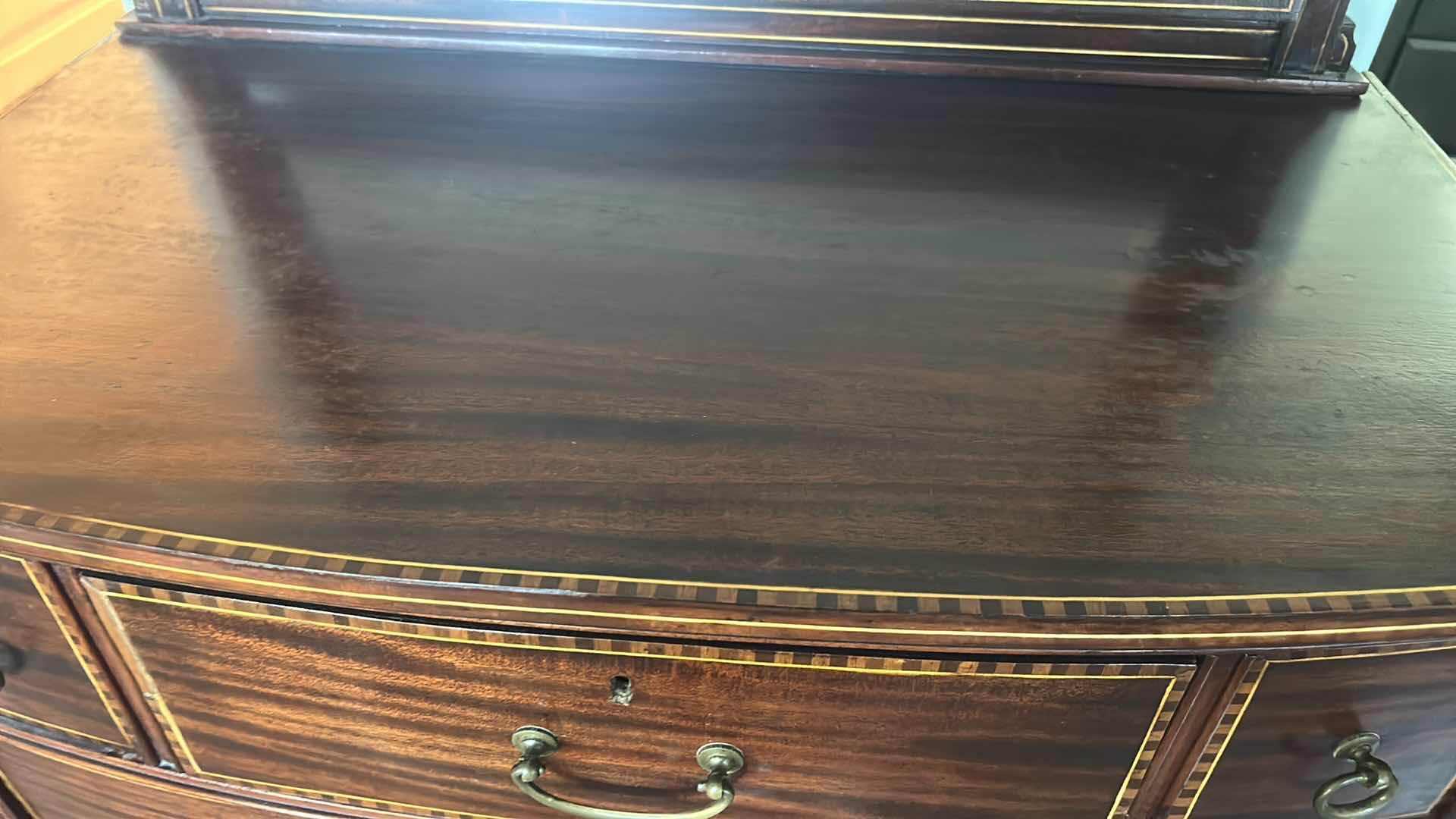 Photo 1 of VINTAGE AMERICAN FEDERAL REVIVAL STYLE BOWFRONT CHEST OF DRAWERS WITH AN ACCOMPANYING ATTACHED TILT MIRROR. RICHLY STAINED MAHOGANY VENEERS DECORATED WITH A DISTINCTIVE "BARBER POLE" CHECKERED BAND INLAY ALONG THE BORDERS OF THE DRAWERS. EXPERTLY CRAFTED