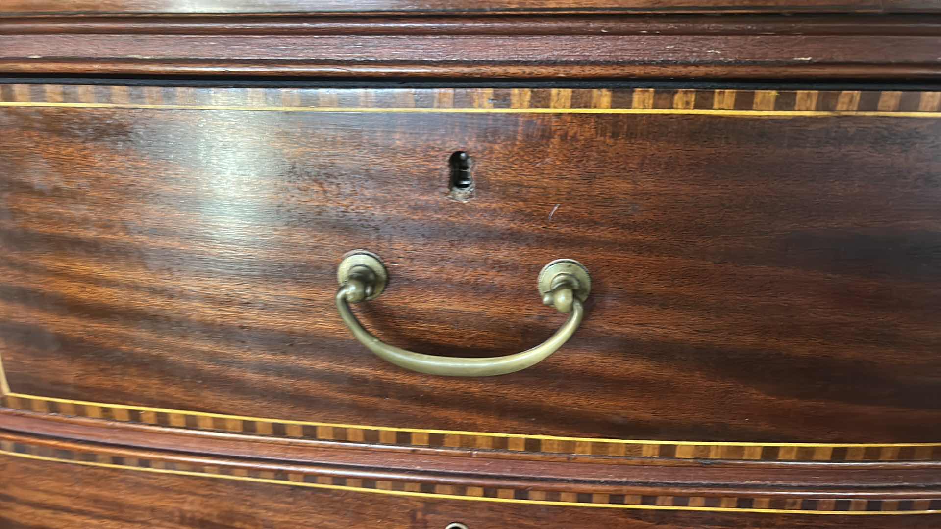 Photo 1 of VINTAGE AMERICAN FEDERAL REVIVAL STYLE BOWFRONT CHEST OF DRAWERS WITH AN ACCOMPANYING ATTACHED TILT MIRROR. RICHLY STAINED MAHOGANY VENEERS DECORATED WITH A DISTINCTIVE "BARBER POLE" CHECKERED BAND INLAY ALONG THE BORDERS OF THE DRAWERS. EXPERTLY CRAFTED