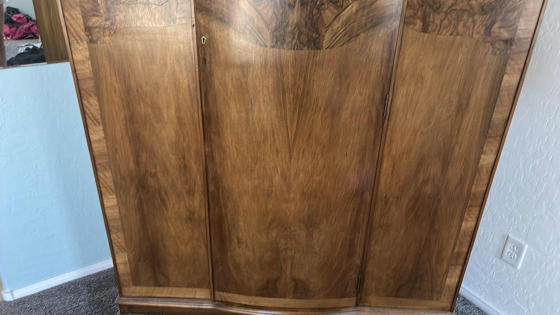 Photo 1 of 1930s ART DECO TRIPLE WARDROBE FEATURES A BOOK MATCHED WALNUT VENEER WITH A CLASSIC ARCHED “CLOUD”TOP SILHOUETTE AND CABRIOLE FEET. $1500 - $2500