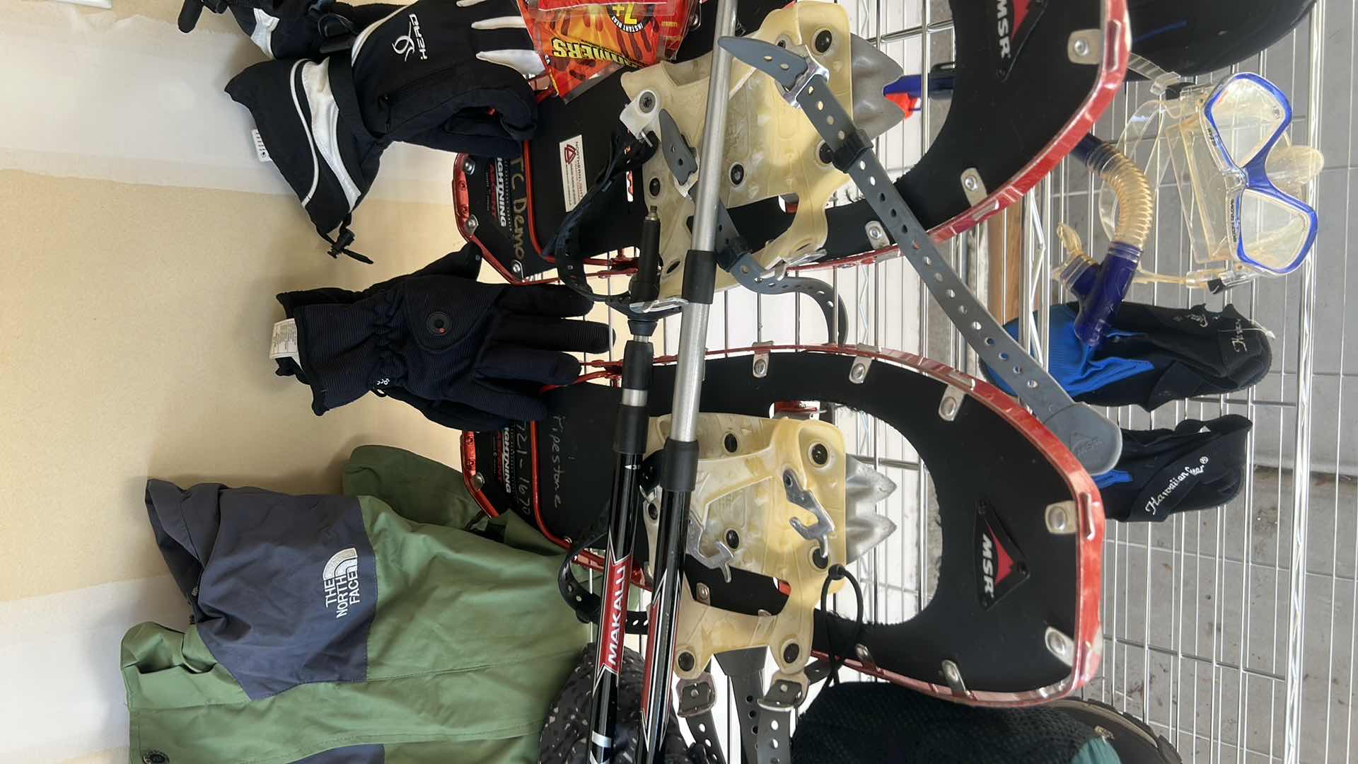 Photo 1 of SNOW SHOES, POLES AND GLOVES, WINTER GARMENTS, AND MORE (SIZE 10 SHOES)