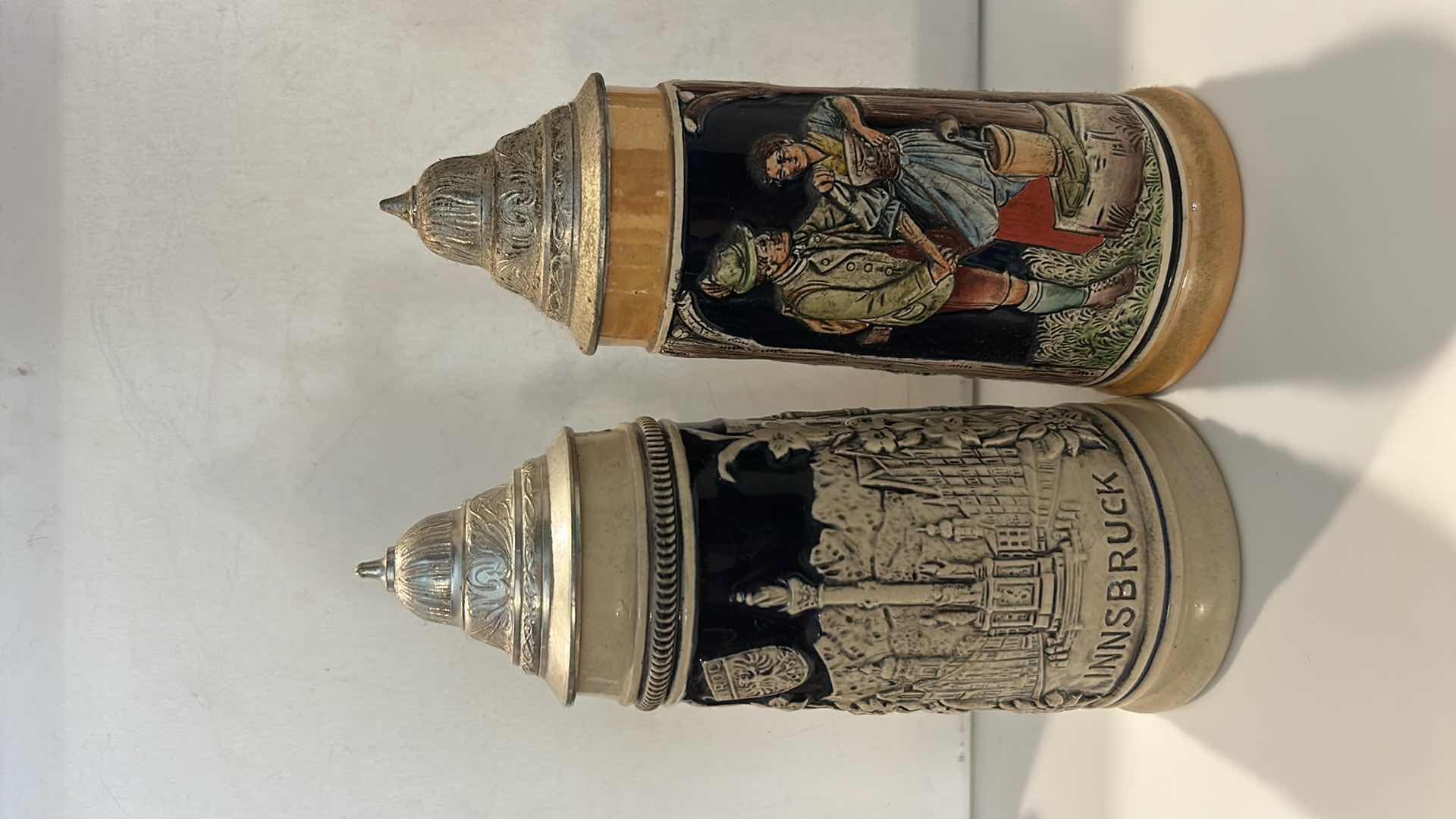 Photo 1 of 2 GERMAN & W GERMAN CERAMIC BEER STEINS