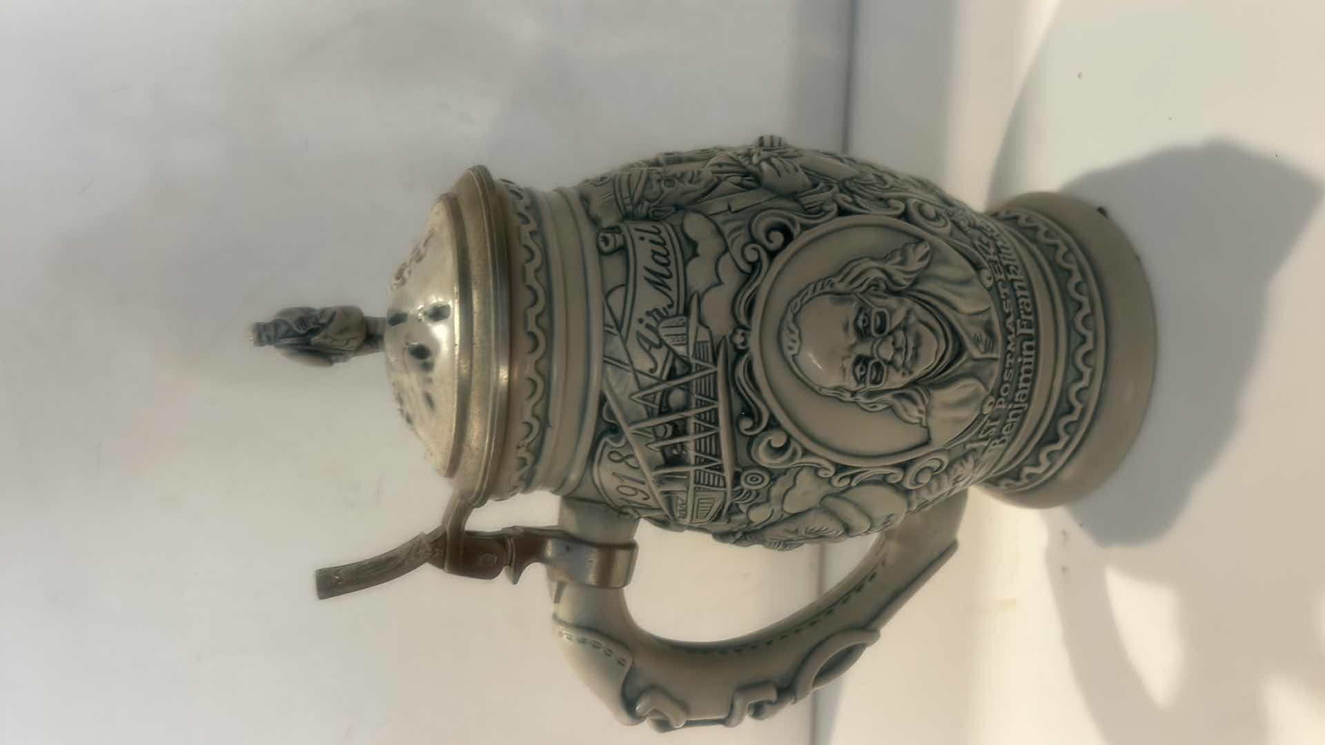 View 2 of AVON CERAMIC BEER STEIN, TITLED "SALUTE TO THE POSTAL SERVICE." H9.5”