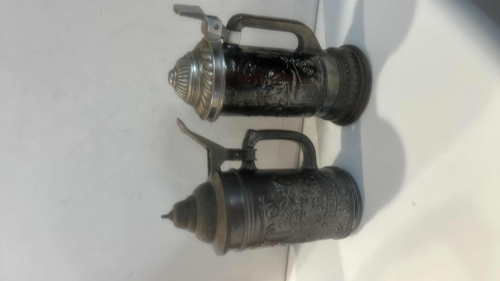 Photo 1 of 2 METALLIC RELIEF BEER STEINS 8”