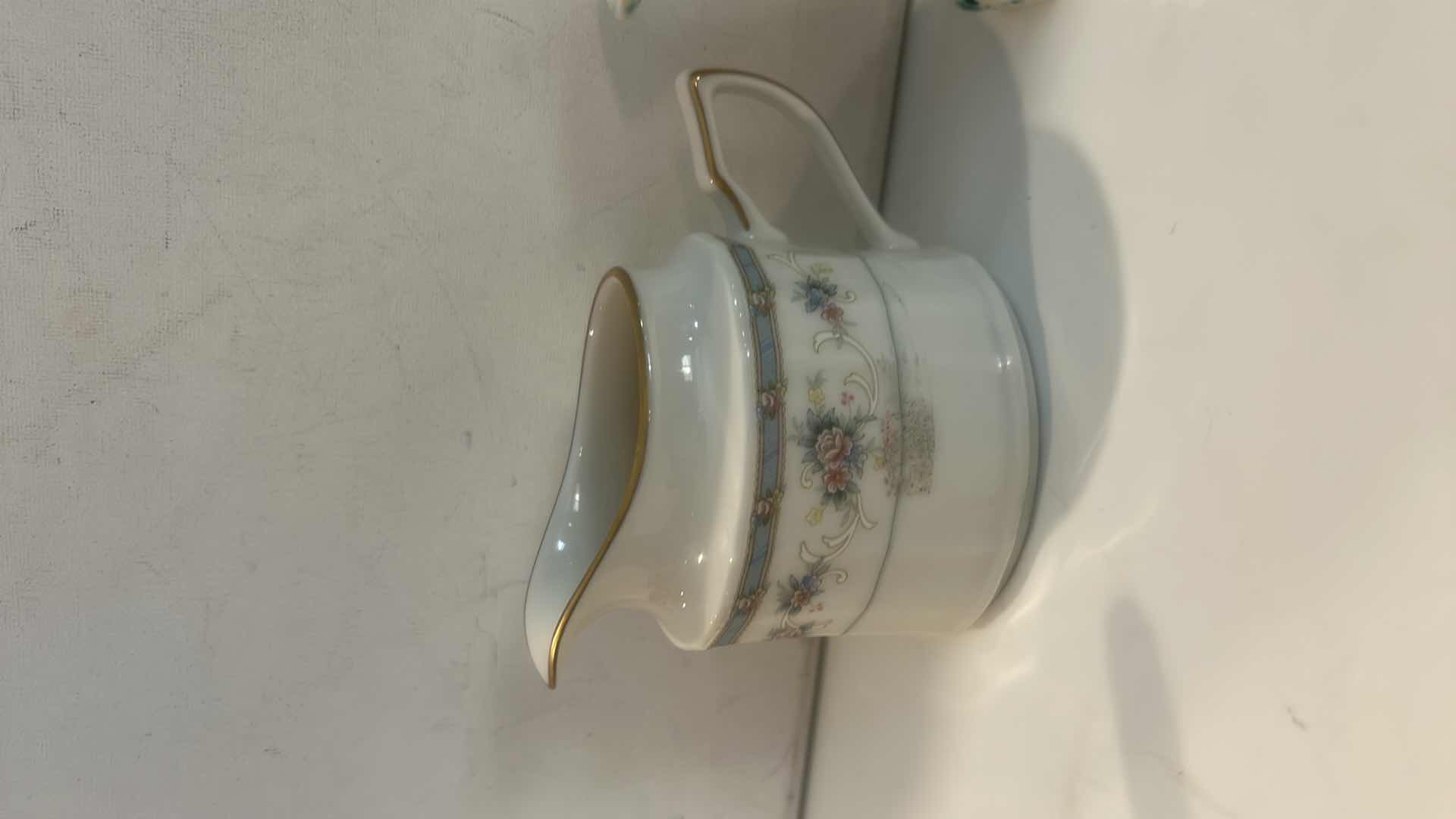 Photo 1 of BLUE SLAG GLASS ROSE PITCHER, PORCELAIN FLORAL CREAMER, & SPATTERWARE ART POTTERY PITCHER H4.5” $65