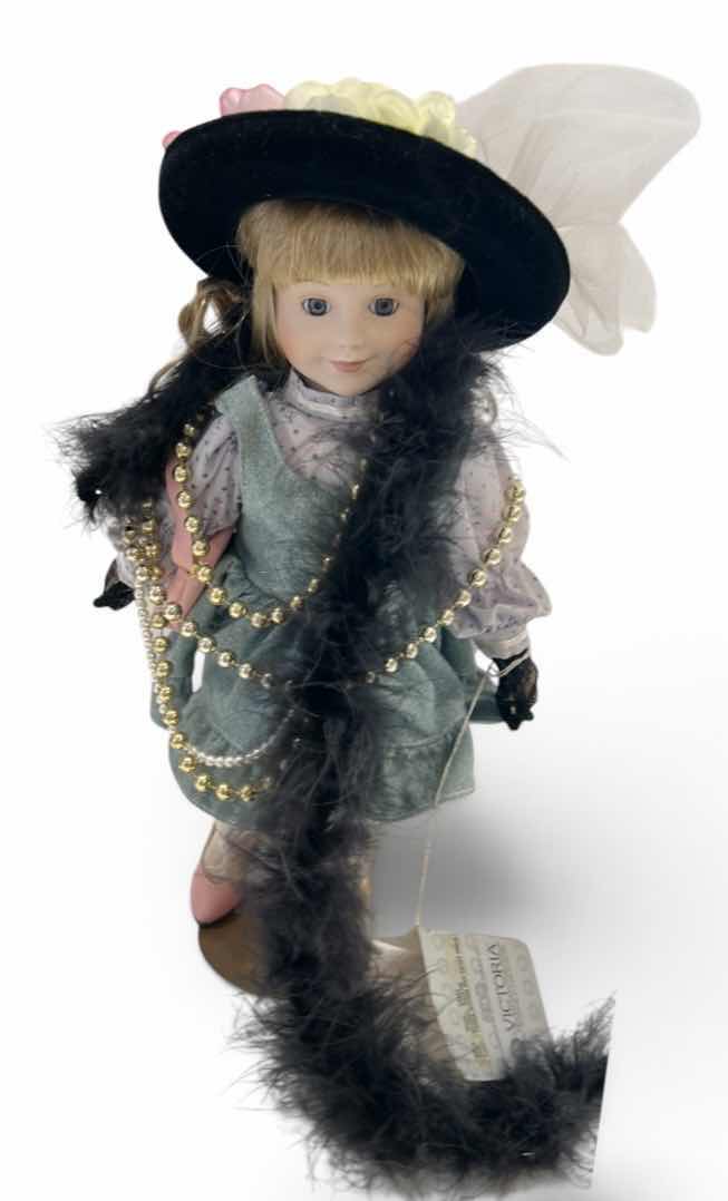 Photo 1 of VINTAGE "LITTLE GIRL PLAYING DRESS UP" MUSICAL PORCELAIN DOLL (NAMED "CASEY"), H14” $50