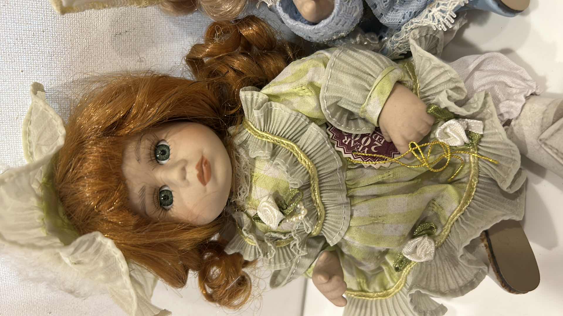 Photo 1 of 3 PORCELAIN DOLLS H8”