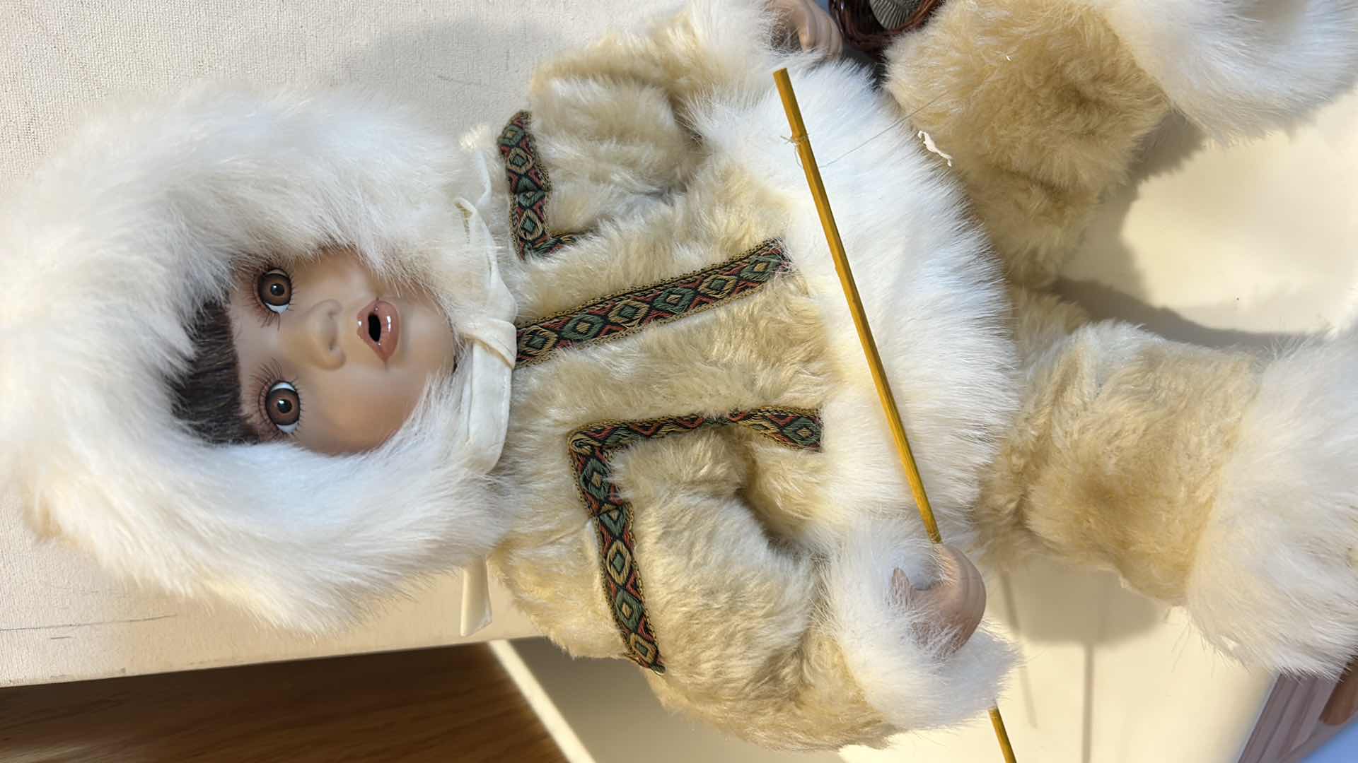 Photo 1 of VINTAGE PORCELAIN DOLL, TRADITIONAL INUIT WINTER PARKA W FISHING ROD & BASKET W FISH $60