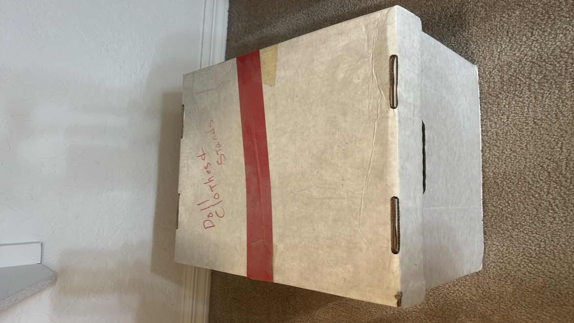 Photo 1 of BOX OF DOLL CLOTHES, AND DOLL STANDS