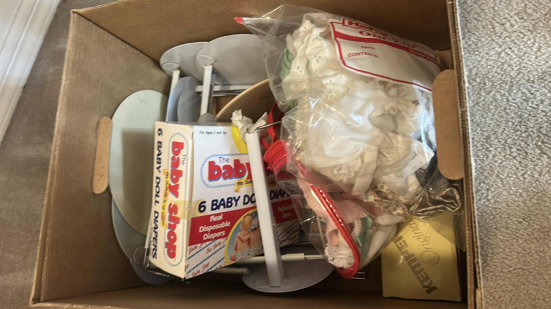 Photo 1 of BOX OF DOLL CLOTHES, AND DOLL STANDS