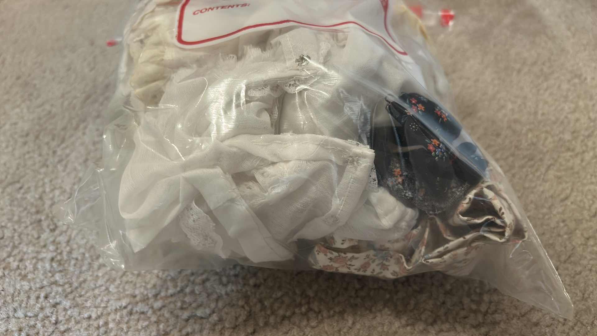 Photo 1 of BOX OF DOLL CLOTHES, AND DOLL STANDS