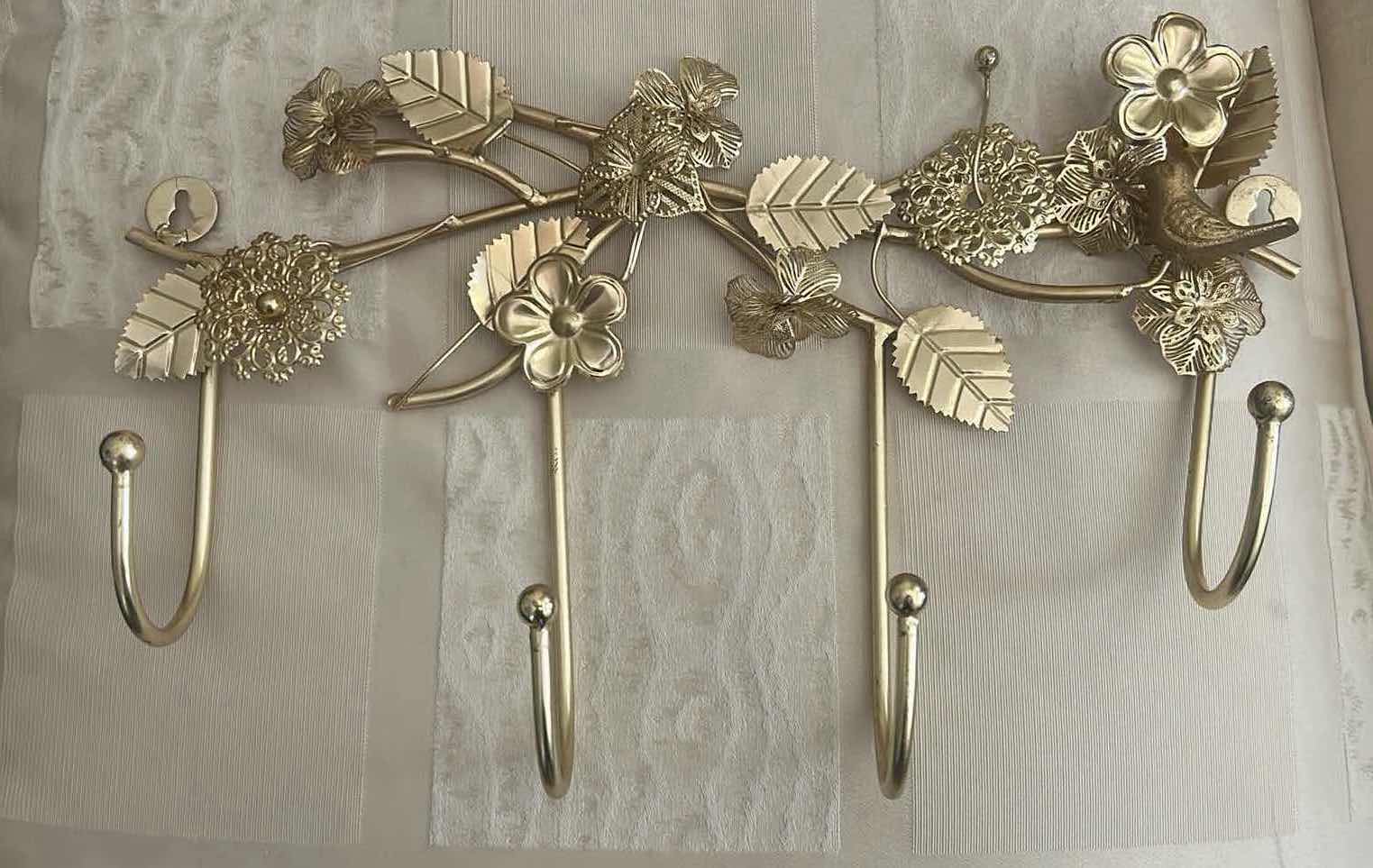 Photo 1 of 2- GOLD TONED OVER THE DOOR HANGER