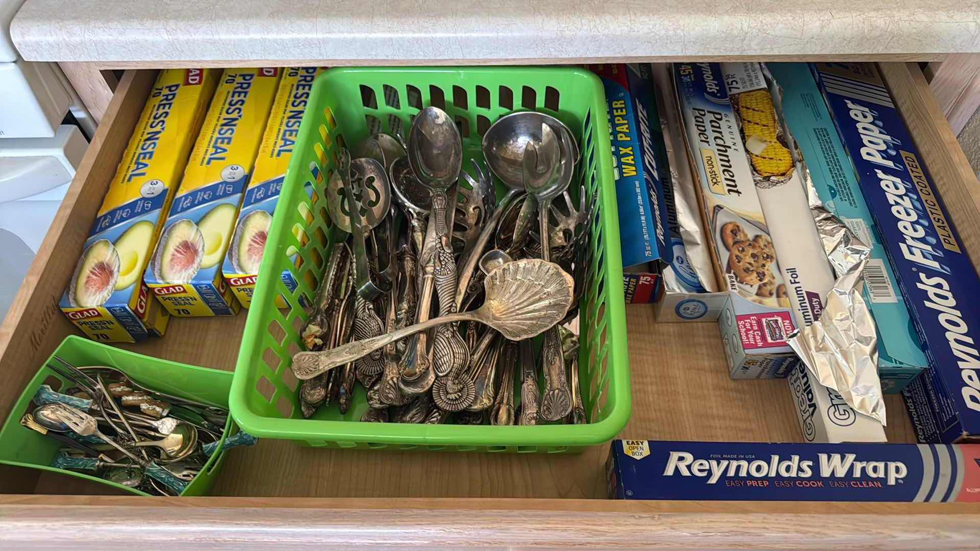 Photo 1 of CONTENTS OF KITCHEN DRAWER, SILVER-PLATED UTENSILS, STORAGE WRAP