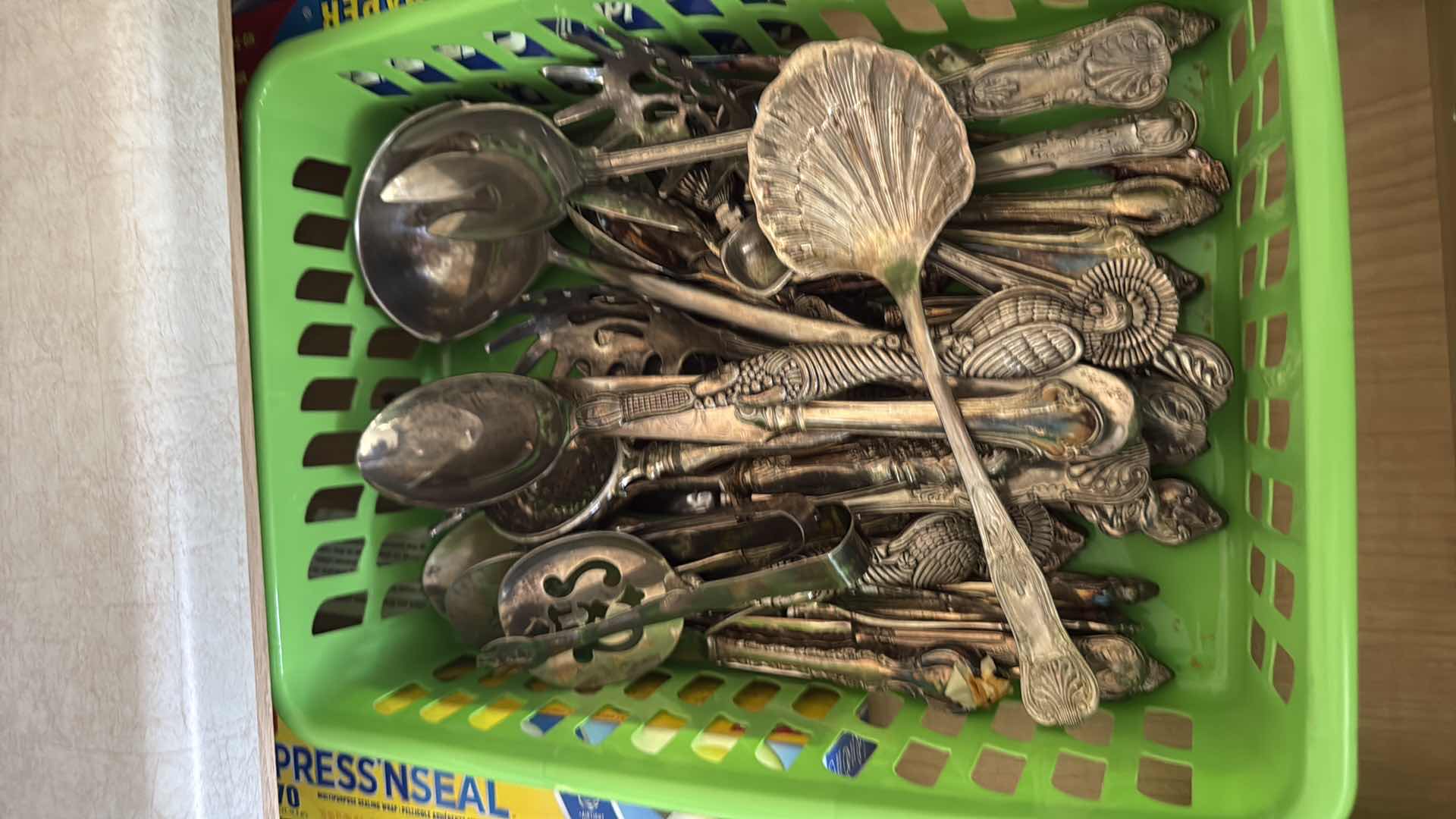Photo 1 of CONTENTS OF KITCHEN DRAWER, SILVER-PLATED UTENSILS, STORAGE WRAP