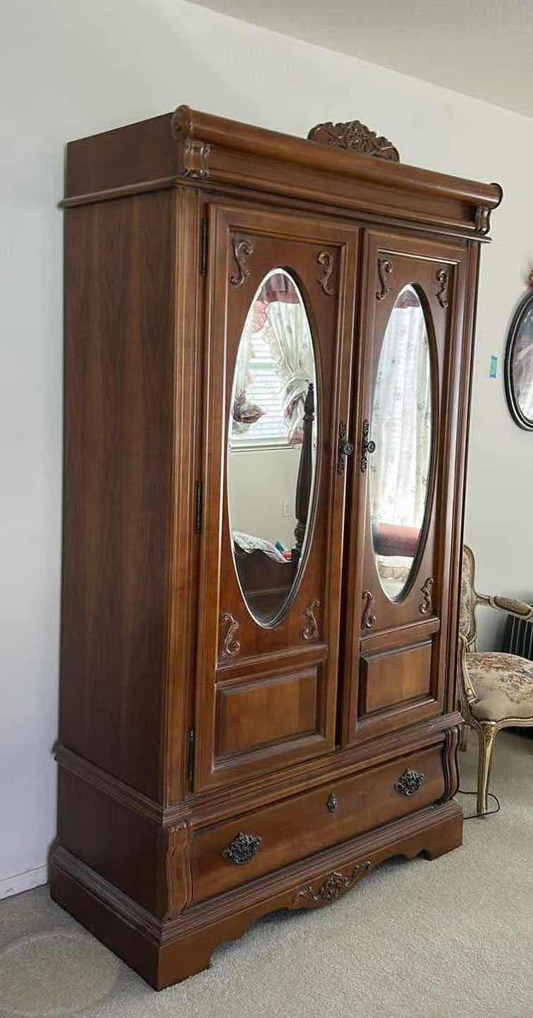 Photo 1 of STANLEY VINTAGE STYLE, DARK WOOD ARMOIRE FEATURING OVAL MIRRORS AND INTRICATE CARVINGS. 44.5” x 19.5” x H 80” $900
