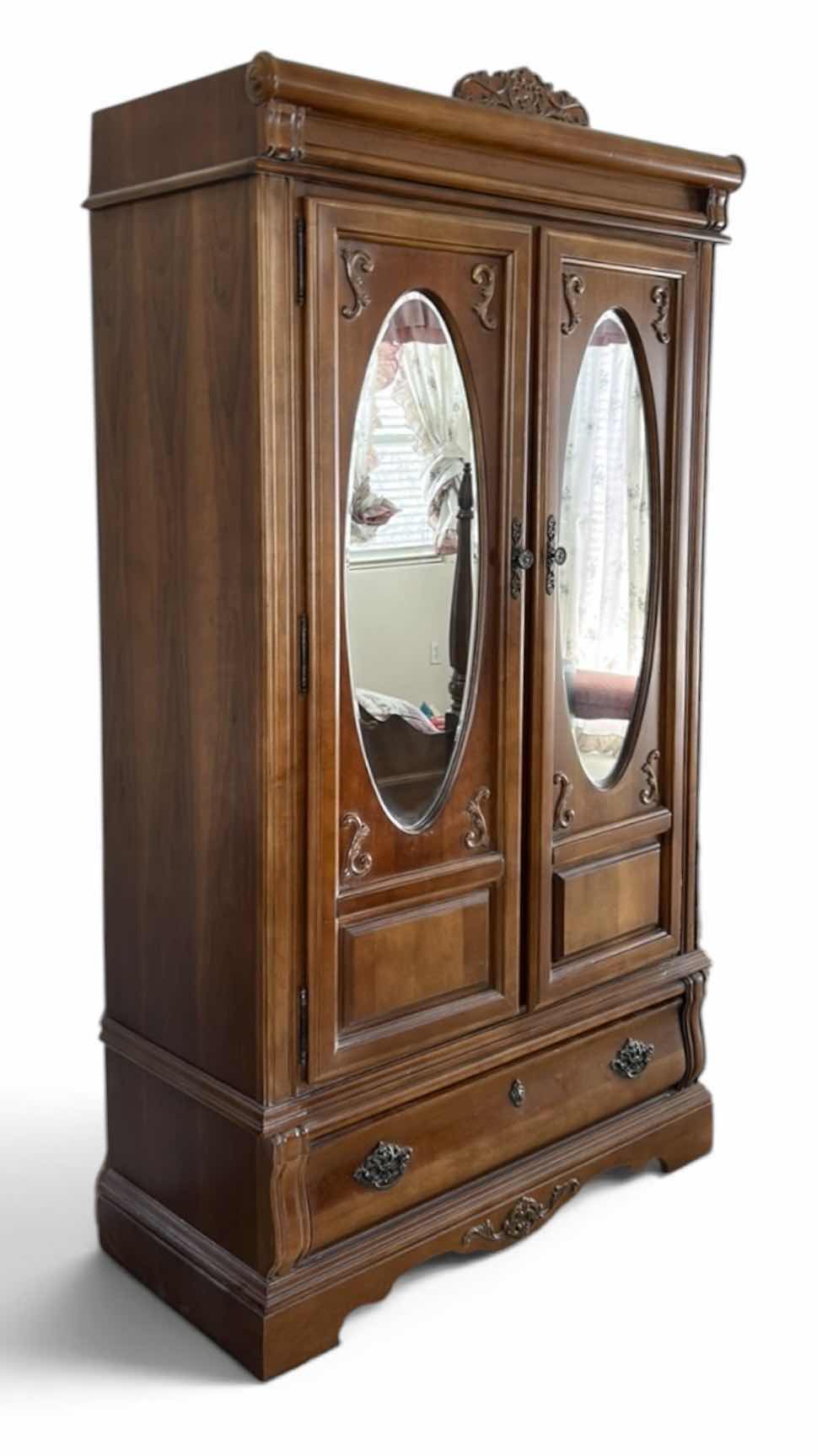 Photo 1 of STANLEY VINTAGE STYLE, DARK WOOD ARMOIRE FEATURING OVAL MIRRORS AND INTRICATE CARVINGS. 44.5” x 19.5” x H 80” $900