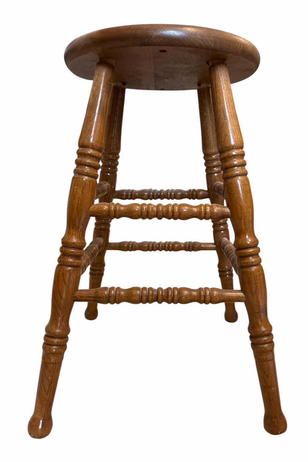 Photo 1 of (2)PCS WOOD MEDIUM OAK BAR STOOLS WITH ROUND SEATS, TURNED LEGS, AND FOOTRESTS H24” $300