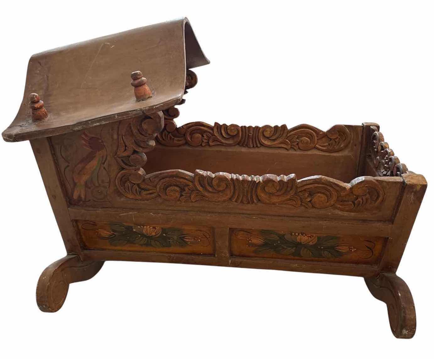 Photo 1 of VINTAGE HAND-PAINTED WOODEN ROCKING DOLL CRADLE W/CARVED DETAILS AND FLORAL ACCENTS 23”X17.5”H16” $300