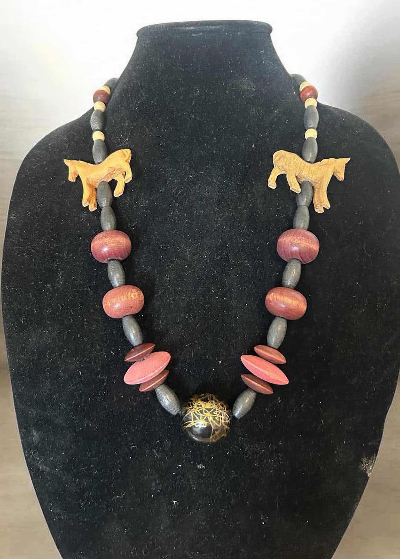 Photo 1 of VINTAGE STYLE HANDCRAFTED STATEMENT NECKLACE W CARVED WOODEN HORSE FIGURES AND PINK BLACK WOODEN BEADS