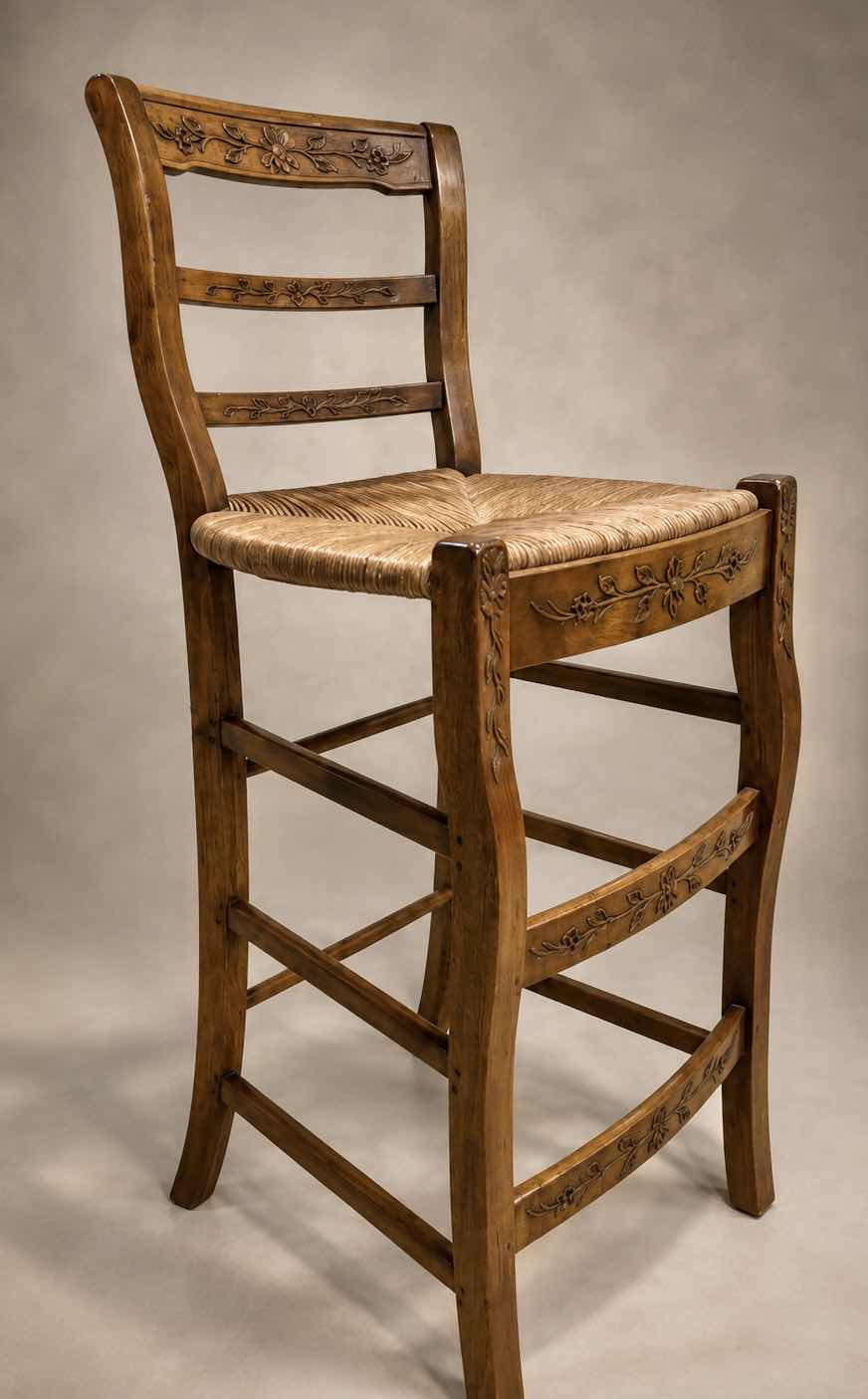 Photo 1 of FRENCH COUNTRY STYLE WOODEN BARSTOOL WITH LADDER BACK FLORAL CARVINGS & HAND WOVEN RUSH SEAT, SEAT HEIGHT 29” OVERALL HEIGHT 41 1/2”