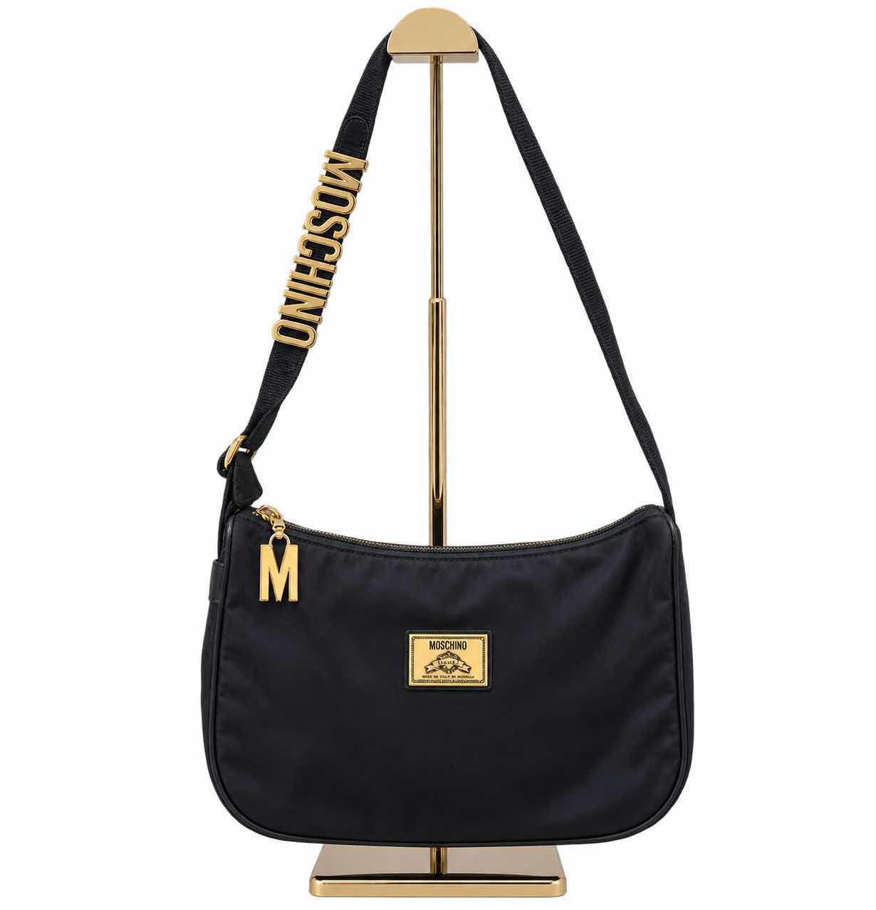 Photo 1 of VINTAGE BLACK NYLON MOSCHINO SHOULDER BAG WITH BRANDS SIGNATURE BLOCK LETTERING ALONG THE STRAP
