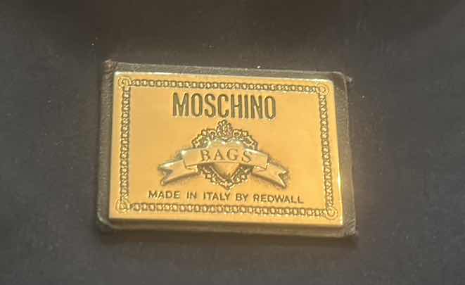 Photo 1 of VINTAGE BLACK NYLON MOSCHINO SHOULDER BAG WITH BRANDS SIGNATURE BLOCK LETTERING ALONG THE STRAP