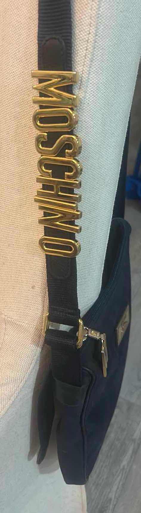 Photo 1 of VINTAGE BLACK NYLON MOSCHINO SHOULDER BAG WITH BRANDS SIGNATURE BLOCK LETTERING ALONG THE STRAP