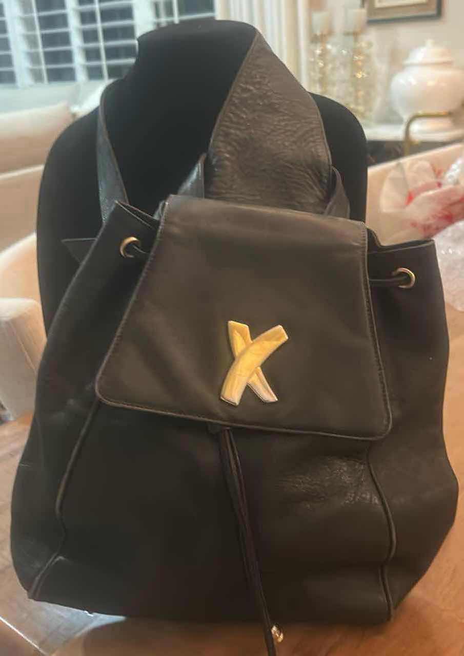 Photo 1 of VINTAGE PALOMA PICASSO BLACK LEATHER DRAWSTRING BACKPACK FEATURES A SLOUCHY BUCKET SILHOUETTE CRAFTED FROM GLOVE-SOFT SMOOTH BLACK LEATHER. EST VALUE $125 - $200