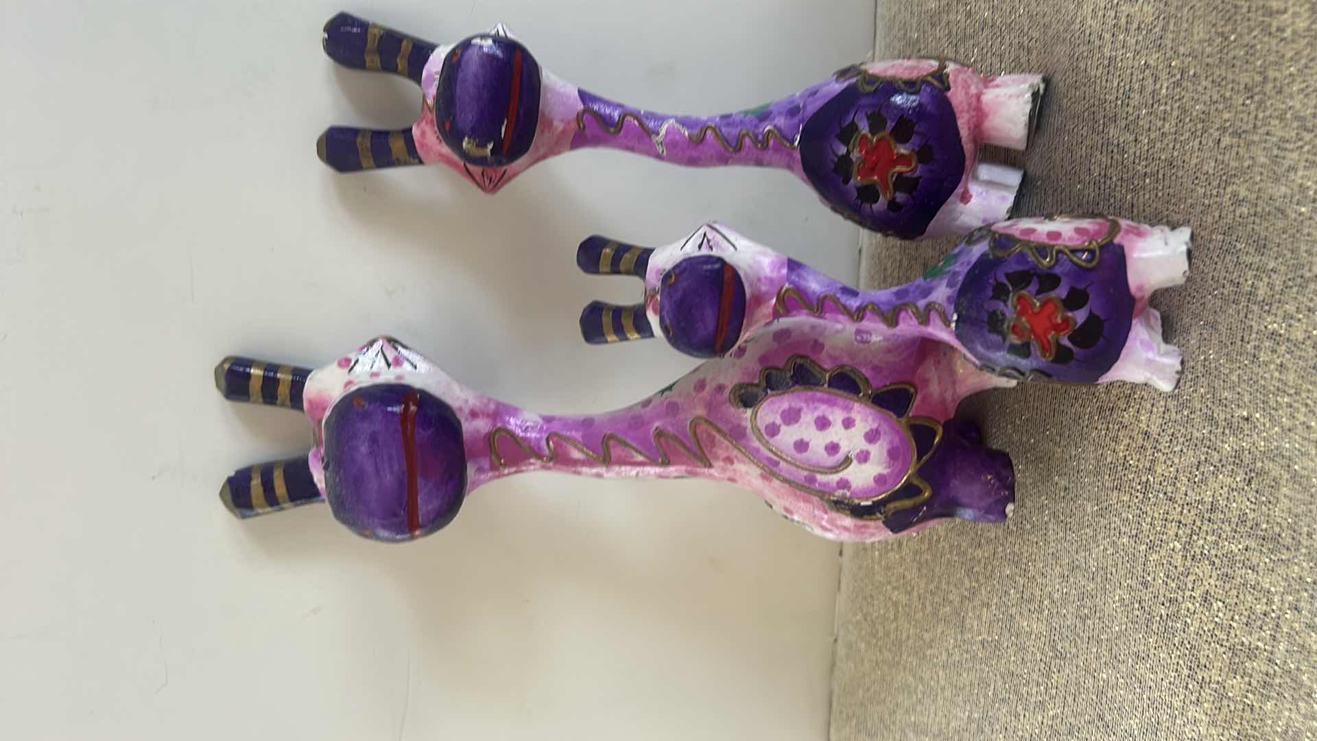 Photo 1 of HANDMADE 3-PIECE WHIMSICAL PURPLE GIRAFFE STATUE SET, TALLEST H10”