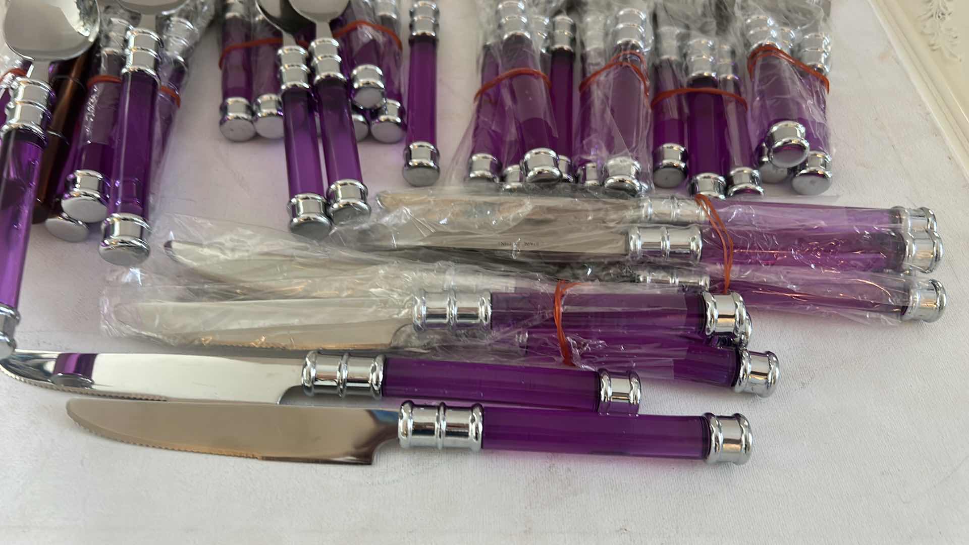 Photo 1 of 40 PC PURPLE HANDLED, STAINLESS STEEL FLATWARE & CUTLERY SET