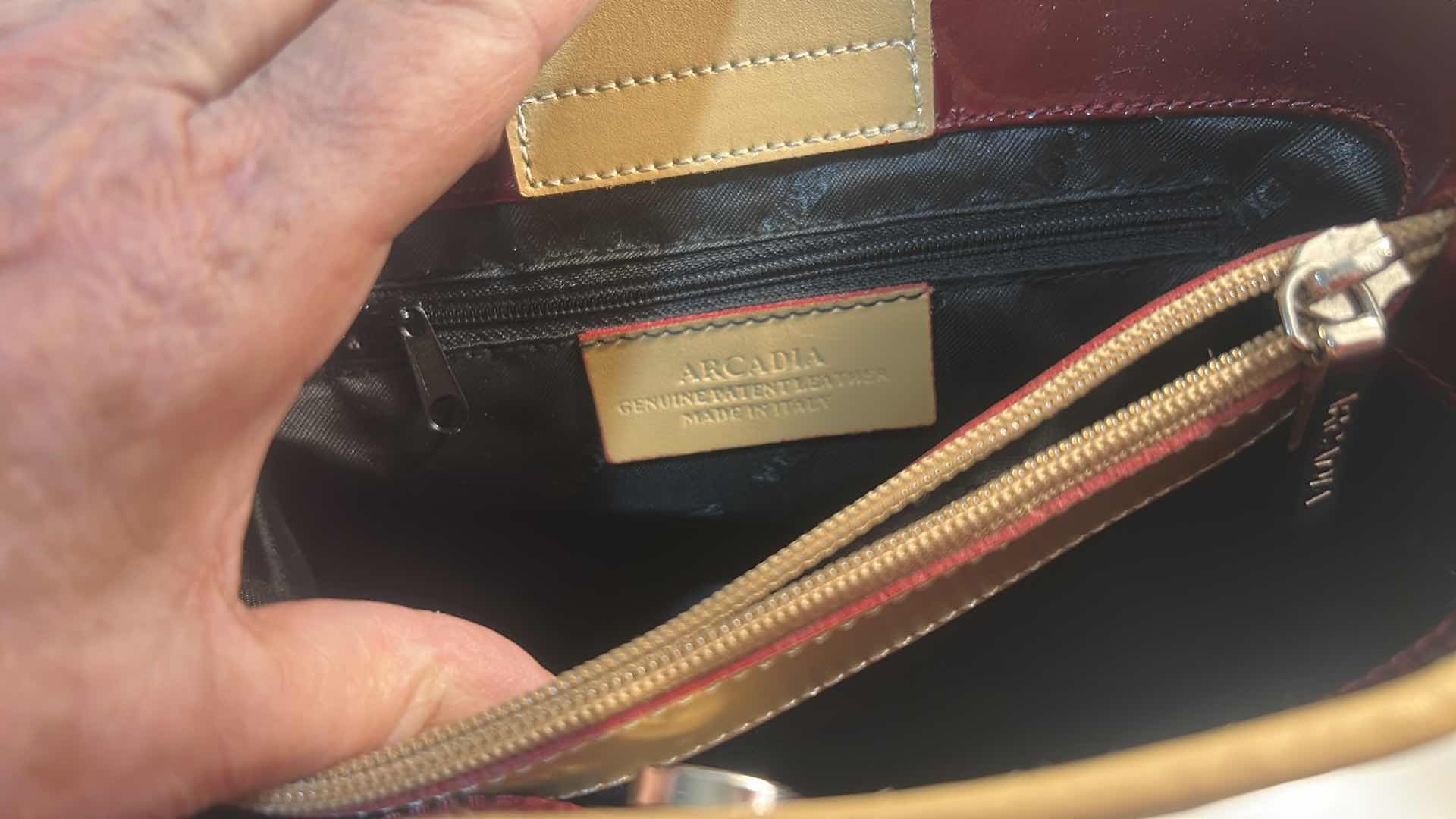 Photo 1 of ARCADIA BURGUNDY EMBOSSED MONOGRAM PATENT LEATHER BUCKET BAG