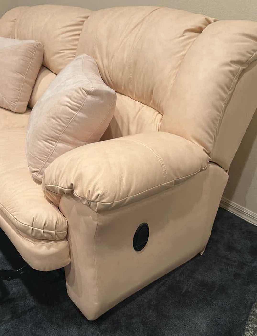 Photo 1 of OFF WHITE LEATHER RECLINING SOFA W COMFORTABLE PADDED CUSHIONS W DIAGONAL SEAM DETAIL 2 ACCENT PILLOWS