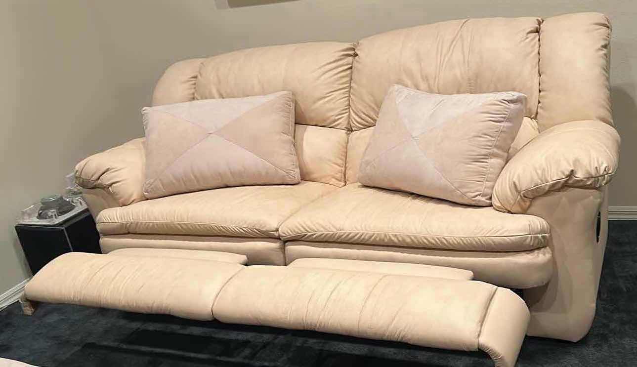 Photo 1 of OFF WHITE LEATHER RECLINING SOFA W COMFORTABLE PADDED CUSHIONS W DIAGONAL SEAM DETAIL 2 ACCENT PILLOWS