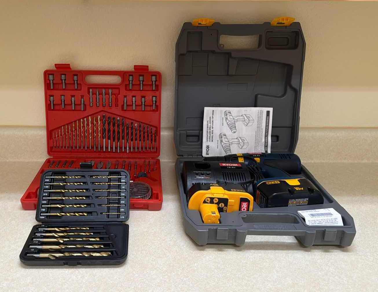 Photo 1 of RYOBI CORDLESS DRILL-DRIVER, TWO DRILL SETS