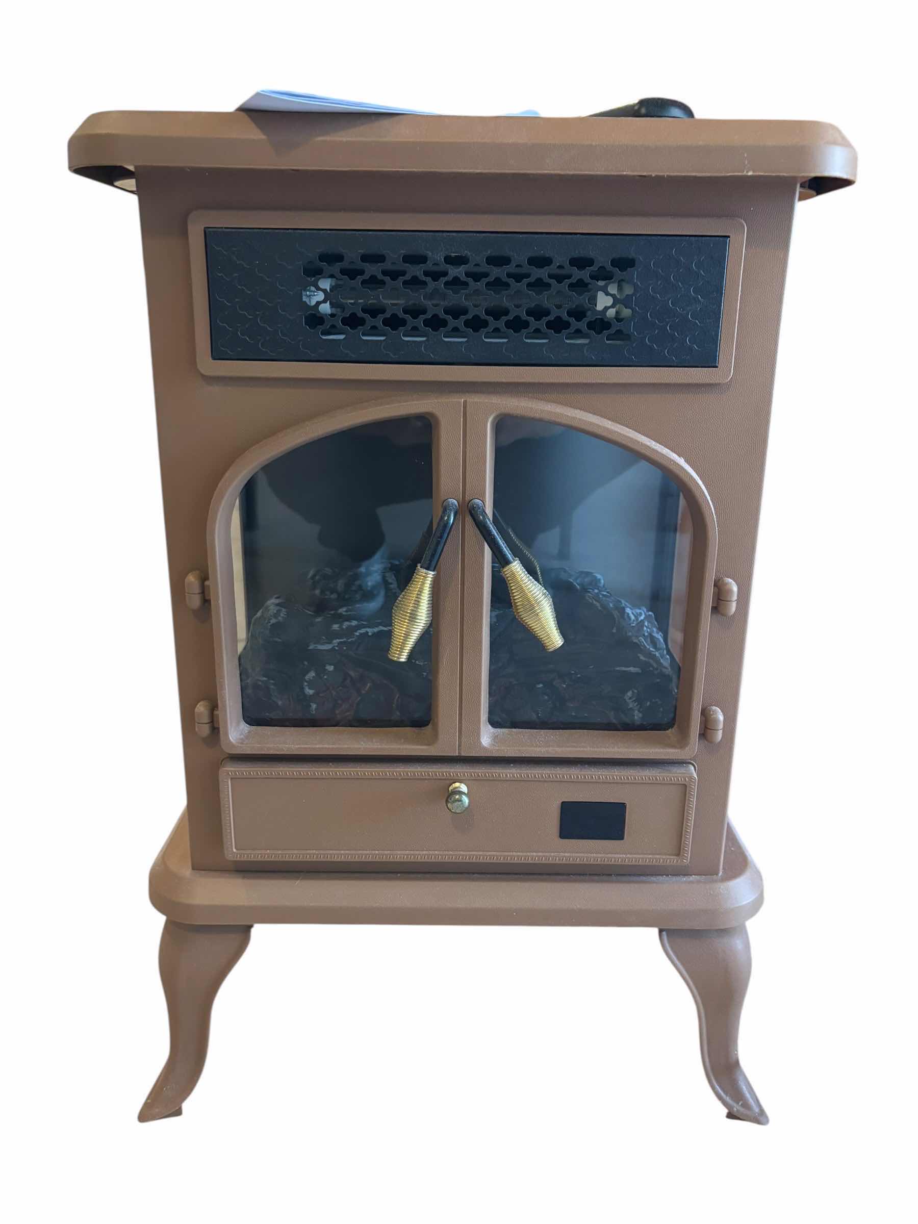 Photo 1 of WARM LIVING FREESTANDING INFRARED STOVE HEATER WITH REMOTE & MANUAL H22.5”