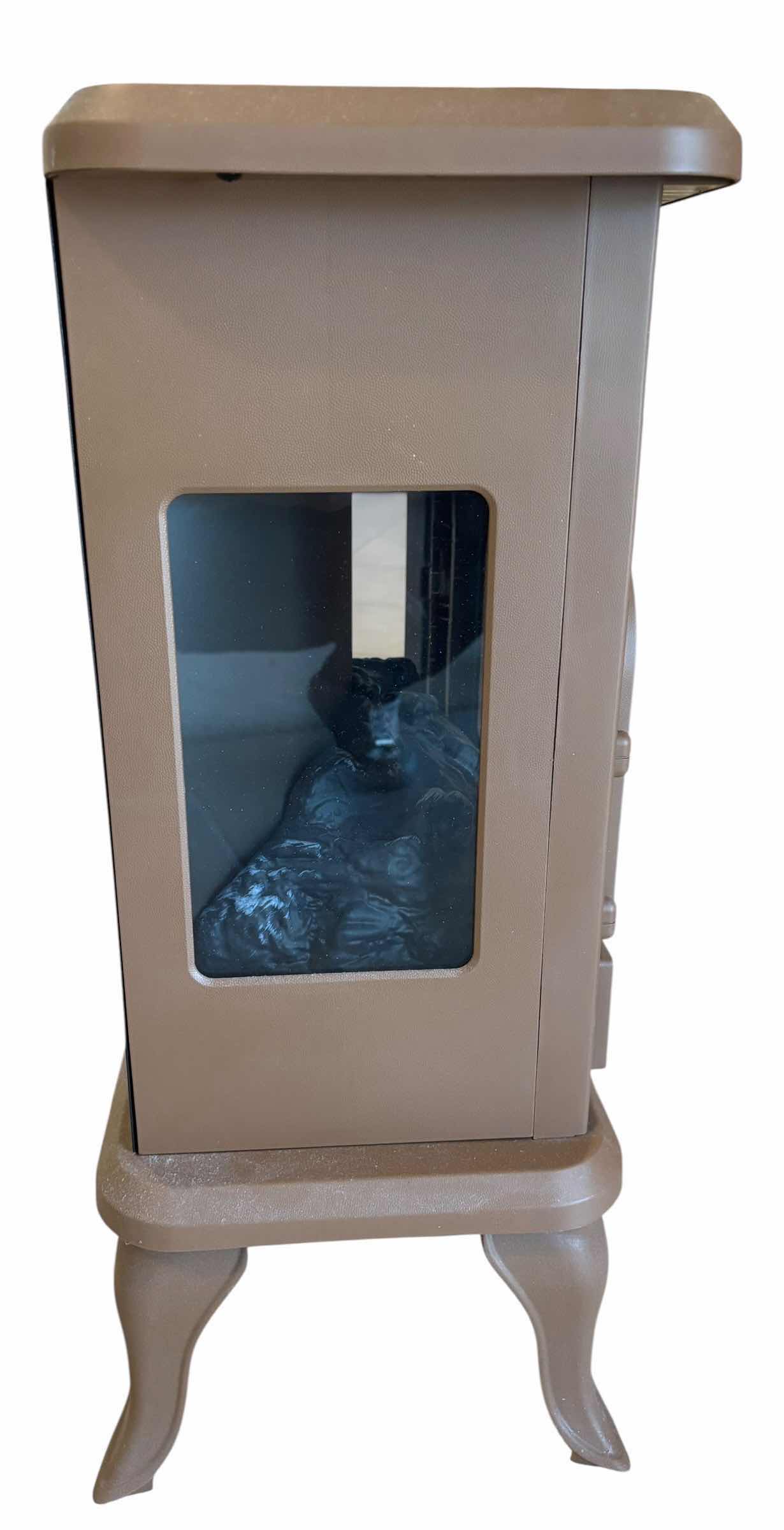 Photo 1 of WARM LIVING FREESTANDING INFRARED STOVE HEATER WITH REMOTE & MANUAL H22.5”