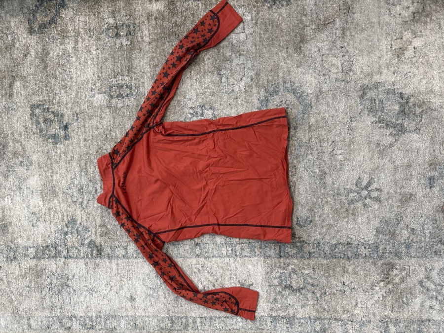 Orange Lemieux size 11/12 long sleeve with stars on them